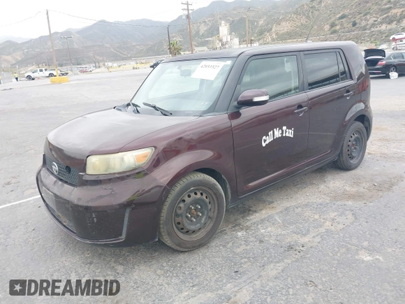 2009 Scion xB with VIN JTLKE50E291081243, listed as a IAAI auction lot 42033327 with 263,903 mi miles. Bid and sale history available at carsss.com. Image 2.