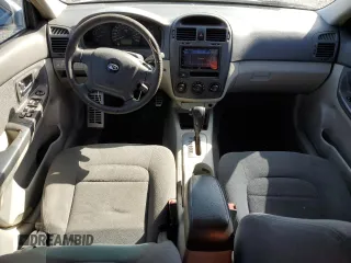 2006 Kia Spectra EX with VIN KNAFE121365229594, listed as a Copart auction lot 77311084 with 129,789 mi miles and Salvage Title. Bid and sale history available at carsss.com. Image 8.