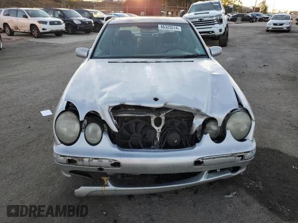 2000 Mercedes-Benz E-Class with VIN WDBJF70JXYB113988, listed as a Copart auction lot 86325514 with 198,321 mi miles and Salvage Title. Bid and sale history available at carsss.com. Image 5.
