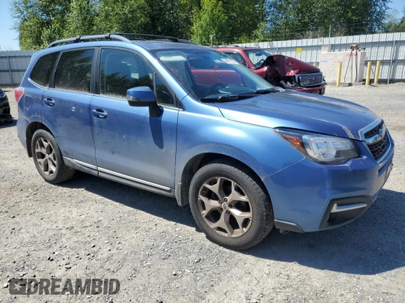 2017 Subaru Forester Touring with VIN JF2SJAWC2HH429099, listed as a Copart auction lot 64671135 with 104,709 mi miles and Salvage title. Bid and sale history available at DreamBid. Image 4.