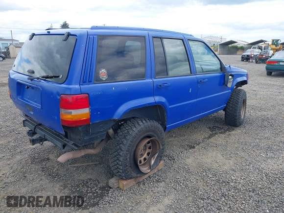 1996 Jeep Grand Cherokee Laredo with VIN 1J4GZ58YXTC329037, listed as a IAAI auction lot 42051175 with 314,571 mi miles and . Bid and sale history available at DreamBid. Image 4.