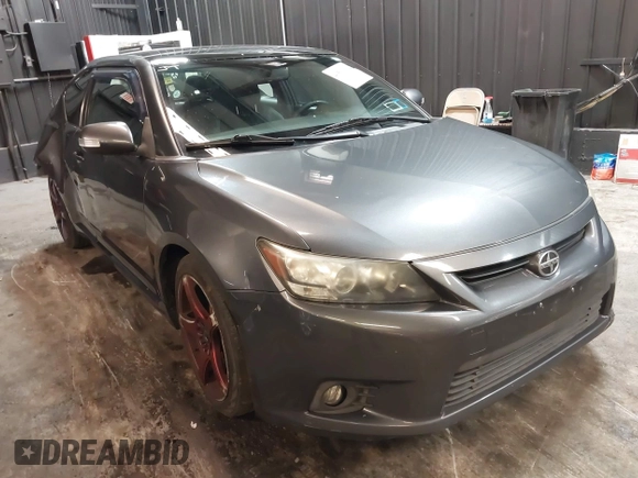 2012 Scion tC with VIN JTKJF5C7XC3034998, listed as a IAAI auction lot 41591632 with 171,121 mi miles. Bid and sale history available at carsss.com. Image 1.