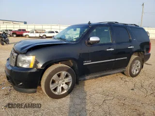 2014 Chevrolet Tahoe LTZ with VIN 1GNSKCE07ER137878, listed as a Copart auction lot 59905605 with 213,584 mi miles and Salvage title. Bid and sale history available at DreamBid. Image 1.