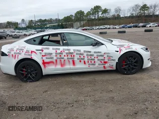 2023 Tesla Model S Plaid with VIN 5YJSA1E68PF507197, listed as a IAAI auction lot 42062258 with Not provided miles and . Bid and sale history available at DreamBid. Image 13.