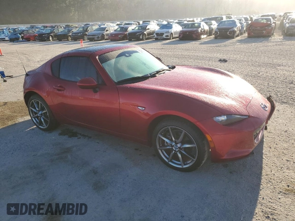 2023 Mazda MX-5 Miata Grand Touring with VIN JM1NDAM71P0559428, listed as a Copart auction lot 76596984 with 7,237 mi miles and Salvage title. Bid and sale history available at DreamBid. Image 4.