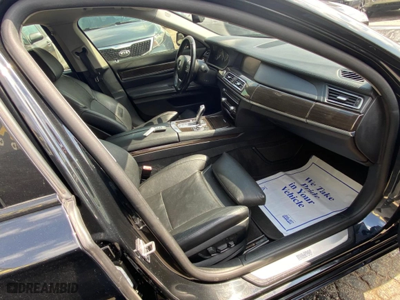 2012 BMW 7 Series 740Li with VIN WBAKB4C55CC576166, listed as a Copart auction lot 52448115 with 154,949 mi miles and Clean Title. Bid and sale history available at carsss.com. Image 5.