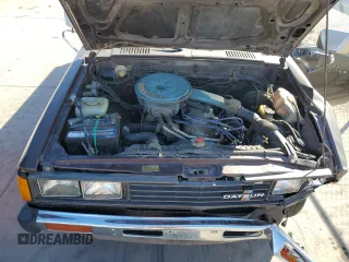 1982 Datsun 720 z VIN JN6MD01S3CW124932, wystawiony jako Copart lot #47493805 z przebiegiem 161 654 mil mil oraz Szkody całkowita. Historia ofert i sprzedaży dostępna na DreamBid. Obrazek 11.