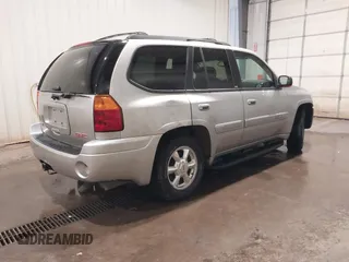 2004 GMC Envoy SLE with VIN 1GKDT13S042243883, listed as a IAAI auction lot 41795335 with 162,873 mi miles. Bid and sale history available at carsss.com. Image 4.