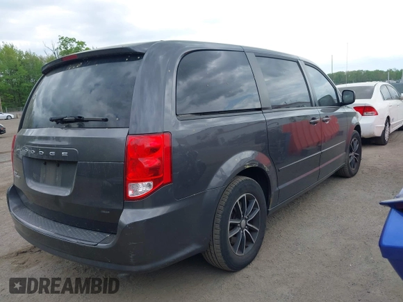 2015 Dodge Grand Caravan American Value with VIN 2C4RDGBG2FR542844, listed as a IAAI auction lot 42109983 with 129,718 mi miles and . Bid and sale history available at DreamBid. Image 4.