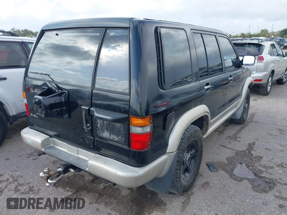 1999 Isuzu Trooper S with VIN JACDJ58X5X7902821, listed as a IAAI auction lot 40762329 with 182,773 mi miles and . Bid and sale history available at DreamBid. Image 4.