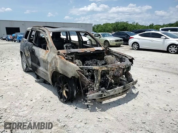 2015 Jeep Grand Cherokee Summit z VIN 1C4RJFJGXFC815431, wystawiony jako Copart lot #62073025 z przebiegiem Nie podano mil oraz Nie do naprawy • Non repairable. Historia ofert i sprzedaży dostępna na DreamBid. Obrazek 13.