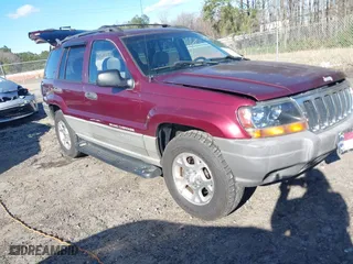1999 Jeep Grand Cherokee Laredo with VIN 1J4GW58S5XC781472, listed as a IAAI auction lot 41738515 with 216,000 mi miles. Bid and sale history available at carsss.com. Image 1.