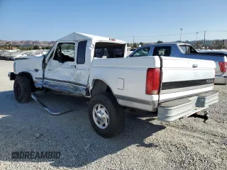 1996 Ford F-250 with VIN 1FTHX25F1TEA60108, listed as a Copart auction lot 75270254 with 205,770 mi miles and Salvage Title. Bid and sale history available at carsss.com. Image 2.