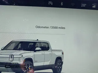 2022 Rivian R1T Adventure Package with VIN 7FCTGAAA1NN012328, listed as a IAAI auction lot 41307929 with 13,588 mi miles. Bid and sale history available at carsss.com. Image 15.