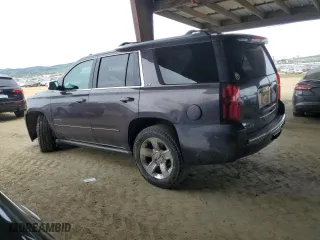 2016 Chevrolet Tahoe LTZ with VIN 1GNSKCKC2GR277192, listed as a Copart auction lot 49552145 with 131,659 mi miles and Salvage Title. Bid and sale history available at carsss.com. Image 2.