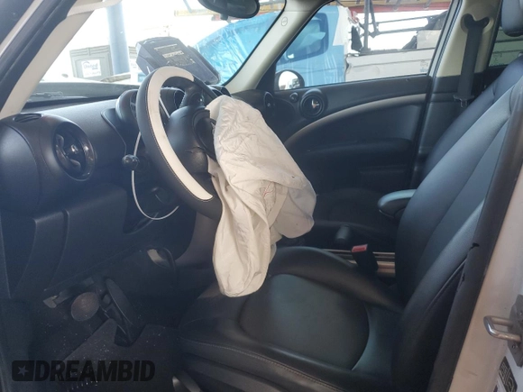 2015 MINI Countryman with VIN WMWZB3C50FWR45253, listed as a Copart auction lot 63608655 with 123,701 mi miles and Salvage title. Bid and sale history available at DreamBid. Image 7.