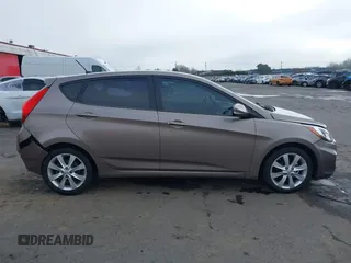 2013 Hyundai Accent SE z VIN KMHCU5AE1DU079830, wystawiony jako IAAI lot #41529695 z przebiegiem 105 637 mil mil oraz . Historia ofert i sprzedaży dostępna na DreamBid. Obrazek 13.