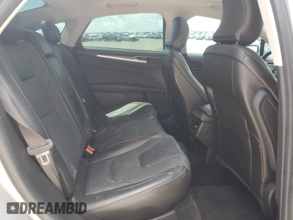 2016 Ford Fusion Titanium z VIN 3FA6P0D94GR181179, wystawiony jako Copart lot #56987005 z przebiegiem 79 841 mil mil oraz Czysty tytuł • Clean title. Historia ofert i sprzedaży dostępna na DreamBid. Obrazek 10.