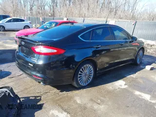 2013 Ford Fusion Titanium Hybrid with VIN 3FA6P0RU5DR339716, listed as a IAAI auction lot 41405835 with 197,840 mi miles. Bid and sale history available at carsss.com. Image 4.