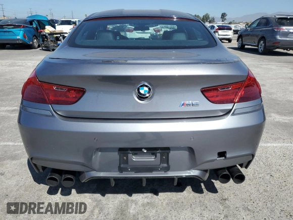 2015 BMW M6 z VIN WBS6C9C56FD467608, wystawiony jako Copart lot #67796074 z przebiegiem 67 706 mil mil oraz Szkoda całkowita • Salvage title. Historia ofert i sprzedaży dostępna na DreamBid. Obrazek 6.