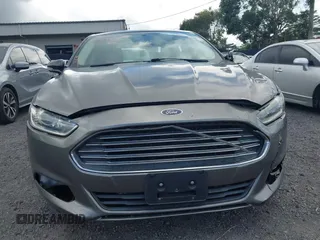 2013 Ford Fusion SE Hybrid z VIN 3FA6P0LUXDR181849, wystawiony jako IAAI lot #41949276 z przebiegiem 112 688 mil mil oraz . Historia ofert i sprzedaży dostępna na DreamBid. Obrazek 12.