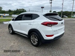2018 Hyundai Tucson SEL z VIN KM8J33A40JU676727, wystawiony jako Copart lot #87532055 z przebiegiem 128 554 mil mil oraz Czysty tytuł • Clean title. Historia ofert i sprzedaży dostępna na DreamBid. Obrazek 3.
