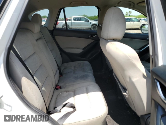 2014 Mazda CX-5 Touring with VIN JM3KE2CY9E0305244, listed as a Copart auction lot 56205605 with 164,516 mi miles and Salvage Title. Bid and sale history available at DreamBid. Image 11.