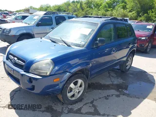 2006 Hyundai Tucson GL with VIN KM8JM12B06U386154, listed as a IAAI auction lot 41989899 with 168,069 mi miles. Bid and sale history available at carsss.com. Image 2.