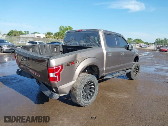 2018 Ford F-150 XL with VIN 1FTEW1EG1JFC31794, listed as a IAAI auction lot 41304111 with 129,058 mi miles and . Bid and sale history available at carsss.com. Image 4.