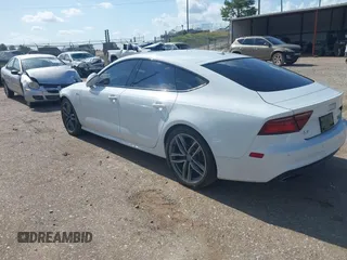 2016 Audi A7 Premium Plus with VIN WAUWGAFC2GN021696, listed as a IAAI auction lot 42595234 with 112,464 mi miles and . Bid and sale history available at DreamBid. Image 3.