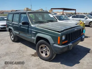 1997 Jeep Cherokee Sport z VIN 1J4FJ68S1VL517260, wystawiony jako IAAI lot #42660421 z przebiegiem 120 496 mil mil oraz . Historia ofert i sprzedaży dostępna na DreamBid. Obrazek 1.