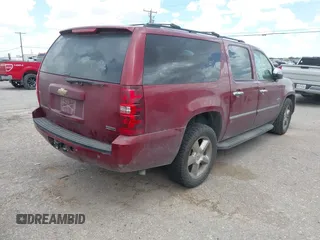 2011 Chevrolet Suburban LT with VIN 1GNSCJE0XBR355603, listed as a IAAI auction lot 42555932 with 240,213 mi miles and . Bid and sale history available at DreamBid. Image 4.