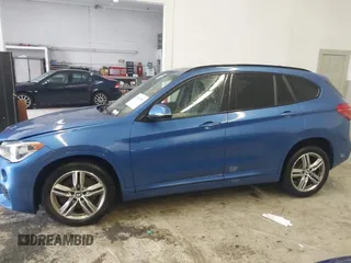 2019 BMW X1 xDrive28i with VIN WBXHT3C53K5L36690, listed as a IAAI auction lot 42012992 with 70,339 mi miles. Bid and sale history available at carsss.com. Image 14.