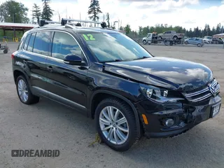 2012 Volkswagen Tiguan SE with VIN WVGBV7AX5CW561368, listed as a IAAI auction lot 42197389 with 63,809 mi miles and . Bid and sale history available at DreamBid. Image 1.