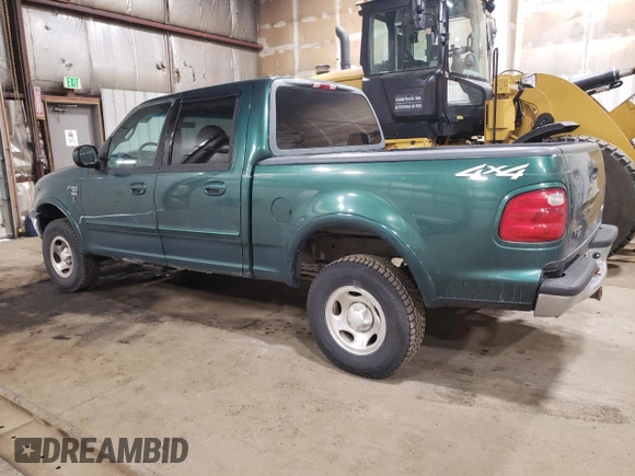 2001 Ford F-150 XLT with VIN 1FTRW08W41KD98737, listed as a Copart auction lot 64695065 with 179,158 mi miles and Clean title. Bid and sale history available at DreamBid. Image 2.
