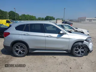 2018 BMW X1 xDrive28i with VIN WBXHT3C39J5L27926, listed as a IAAI auction lot 42582330 with 101,197 mi miles and . Bid and sale history available at DreamBid. Image 13.