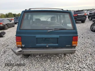 1996 Jeep Cherokee Country with VIN 1J4FJ78S7TL242853, listed as a Copart auction lot 73022554 with 84,868 mi miles and Salvage Title. Bid and sale history available at carsss.com. Image 6.