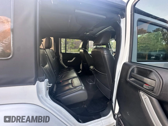 2016 Jeep Wrangler Unlimited Sahara with VIN 1C4BJWEG5GL215915, listed as a Copart auction lot 61690145 with 143,925 mi miles and Clean title. Bid and sale history available at DreamBid. Image 6.