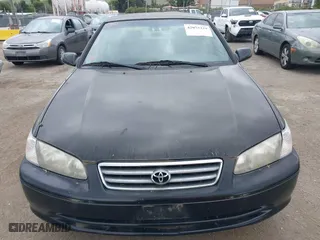 2000 Toyota Camry CE with VIN JT2BG22KXY0499280, listed as a IAAI auction lot 42075329 with 321,420 mi miles. Bid and sale history available at carsss.com. Image 6.