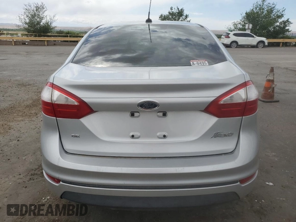 2014 Ford Fiesta SE z VIN 3FADP4BJ8EM133030, wystawiony jako Copart lot #52046065 z przebiegiem 113 792 mil mil oraz Szkoda całkowita • Salvage title. Historia ofert i sprzedaży dostępna na DreamBid. Obrazek 6.