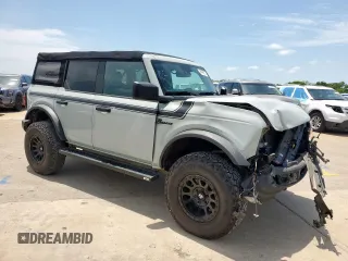 2021 Ford Bronco with VIN 1FMDE5BHXMLA97789, listed as a Copart auction lot 59548025 with 93,959 mi miles and Salvage title. Bid and sale history available at DreamBid. Image 4.