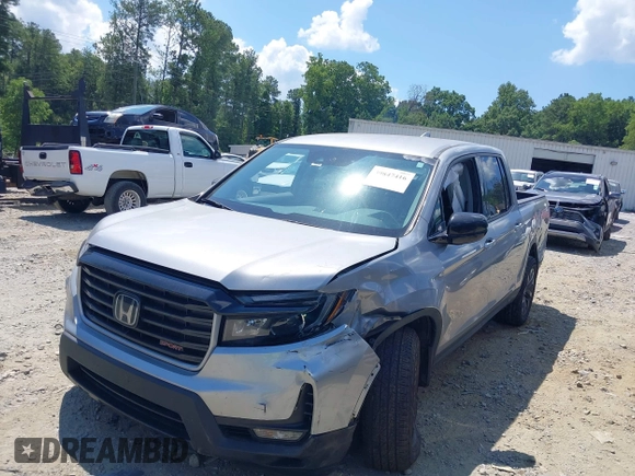 2021 Honda Ridgeline Sport with VIN 5FPYK3F10MB021413, listed as a IAAI auction lot 39847416 with 28,044 mi miles and . Bid and sale history available at DreamBid. Image 2.