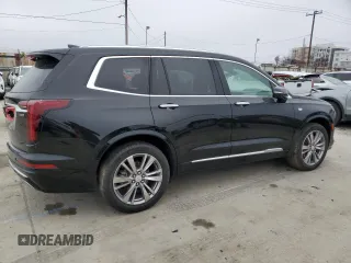 2023 Cadillac XT6 FWD Premium Luxury z VIN 1GYKPCRS5PZ119186, wystawiony jako Copart lot #50577175 z przebiegiem 32 189 mil mil oraz Szkoda całkowita • Salvage title. Historia ofert i sprzedaży dostępna na DreamBid. Obrazek 3.
