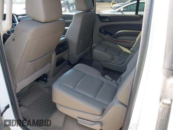 2020 Chevrolet Suburban Premier with VIN 1GNSCJKC9LR125292, listed as a IAAI auction lot 42073858 with 92,363 mi miles and . Bid and sale history available at DreamBid. Image 8.