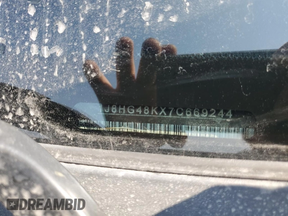 2007 Jeep Commander Sport with VIN 1J8HG48KX7C669244, listed as a Copart auction lot 58709485 with Not provided miles and Clean title. Bid and sale history available at DreamBid. Image 14.