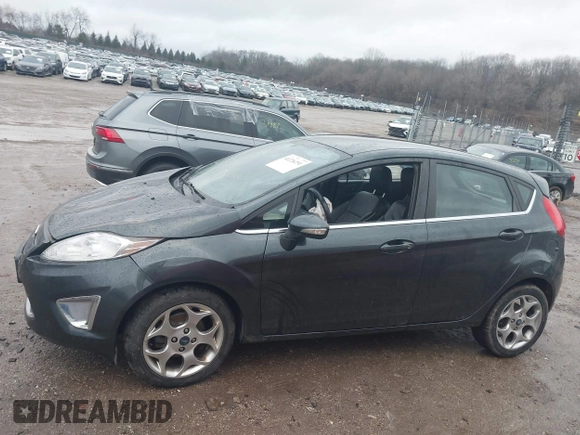 2011 Ford Fiesta SES with VIN 3FADP4FJ7BM111381, listed as a IAAI auction lot 41226251 with 93,694 mi miles. Bid and sale history available at carsss.com. Image 13.