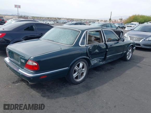 2003 Jaguar XJ with VIN SAJDA15B73MF53499, listed as a IAAI auction lot 41896445 with 95,055 mi miles and . Bid and sale history available at DreamBid. Image 4.