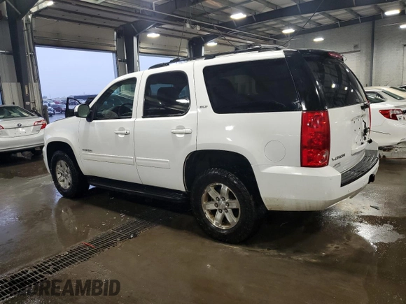 2014 GMC Yukon SLT with VIN 1GKS2CE01ER123696, listed as a Copart auction lot 63401554 with 177,174 mi miles and Salvage Title. Bid and sale history available at carsss.com. Image 2.