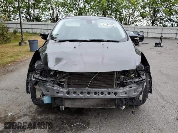 2015 Ford Escape Titanium with VIN 1FMCU9J93FUA67563, listed as a Copart auction lot 61770085 with 134,201 mi miles and Salvage title. Bid and sale history available at DreamBid. Image 5.