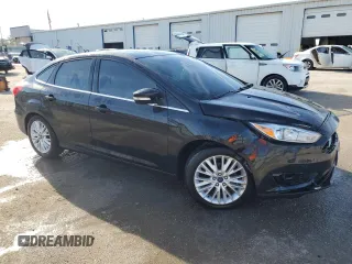 2016 Ford Focus Titanium with VIN 1FADP3J22GL201721, listed as a Copart auction lot 50633795 with 29,801 mi miles and Salvage title. Bid and sale history available at DreamBid. Image 4.